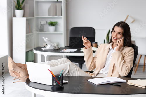 Beautiful businesswoman tal...