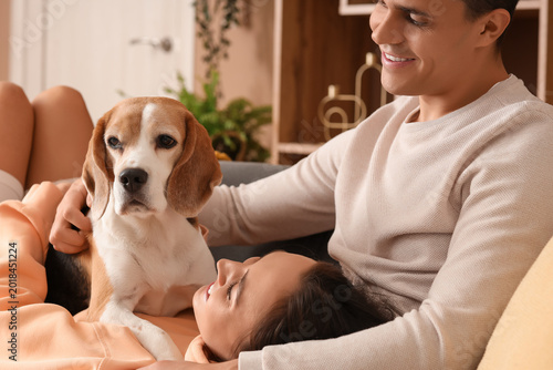 Young couple with cute Beag...