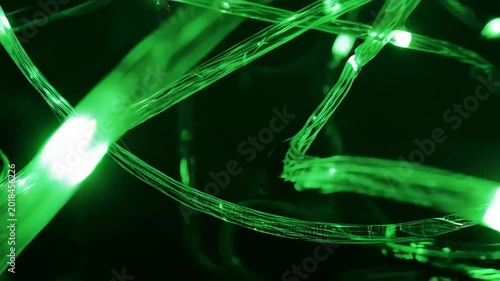 Green fairy lights in heart shape on black background