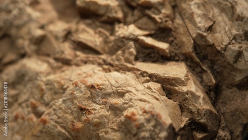 Natural rock fragments texture with warm tones and rough background