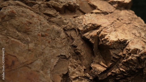 Layered rock texture with warm light and natural abstract background