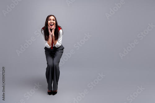 Bilde på lerret Excited businesswoman in glasses expressing surprise and joy while leaning forwa