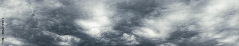 Fototapeta premium panoramic dark sky background. Heavy dark gray clouds in the overcast sky.