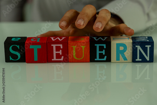 Hand arranging letter block...