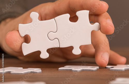 Close-up of a hand placing ...