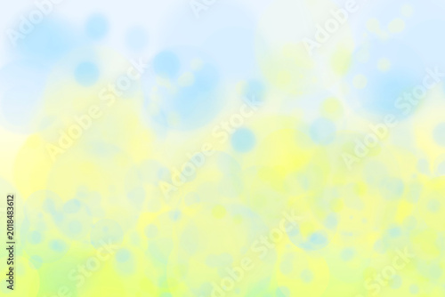 Abstract bright gradient motion spring or summer landscape texture background with natural green blue bokeh lights and yellow bright sunny sky. Beautiful backdrop with space for design.