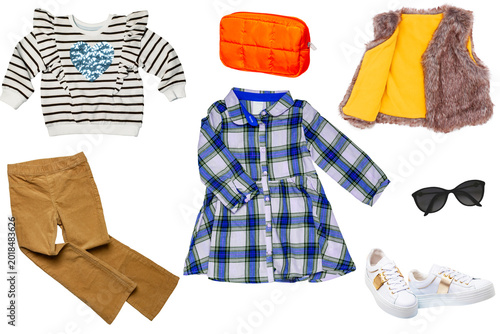 Collage set of little girl spring clothing isolatedon white. The collection of a stylish vest, sweater, skirt, sneaker, shirts and pants. Kids autumn and summer fashion.
