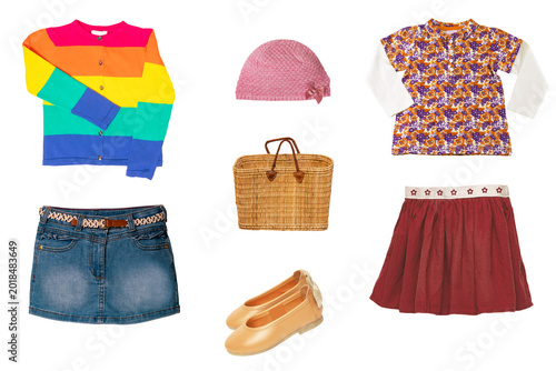 Collage set of little girl summer clothes isolated. Kids apparel collection. Childs fashion clothing outfit. Jeans skirt, shorts, shirts, dresses, hoody, sweater, shoes.