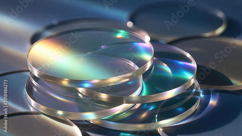 Colorful light refraction on smooth lens discs macro photography studio setting artistic viewpoint