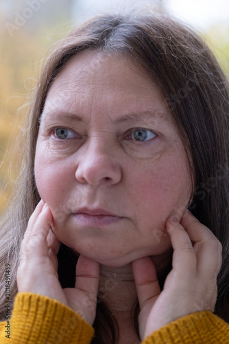 Canvas-taulu Double chin face mature woman 50 years old, human fat neck, wrinkles on skin, fa