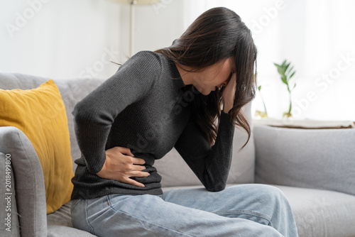 Bild auf Leinwand close up woman suffering stomach pain from food poisoning.