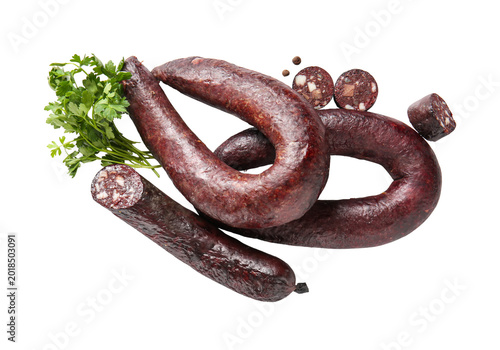 Fotografie Dried black sausage links with fresh parsley, smoked meat product isolated on tr