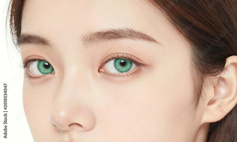 Fototapeta premium photograph young caucasian woman face showcasing luminous complexion striking emerald eye captured soft natural