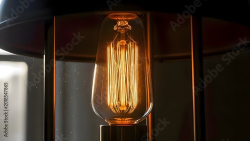Detailed close up of electric light bulb on table for creative photography and modern interior illumination concepts in house