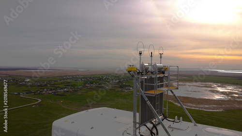 Photos A detailed drone-eye view of the top of a wind turbine nacelle