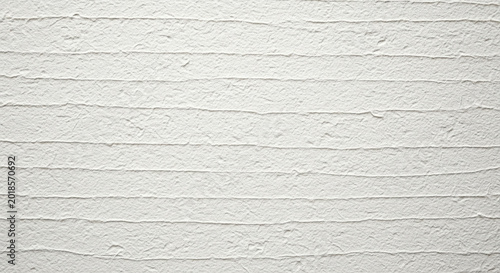 Close-up of smooth, weathered white shiplap wall panels