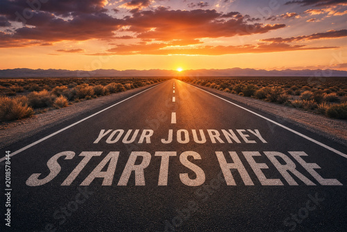 Your journey starts here message on empty road at sunset