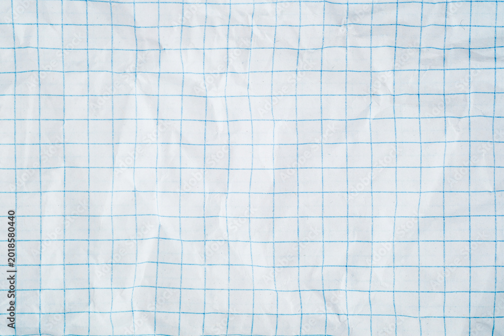 Obraz premium White squared paper texture with blue grid pattern and wrinkled folded surface backdrop