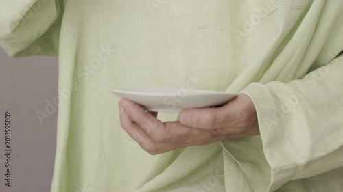 Holding a cup of coffee in hands