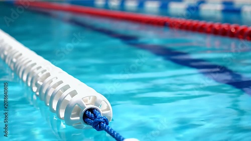 Swimming Pool Lanes - A Close-Up View of Aquatic Boundaries.