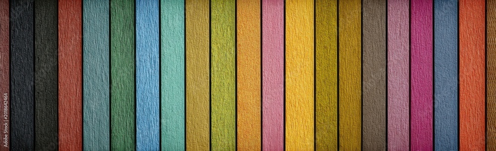 Fototapeta premium A vibrant vertical striped background composed of numerous colored pencils arranged side by side.