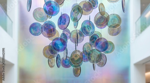 Abstract iridescent floating glass discs gradient design