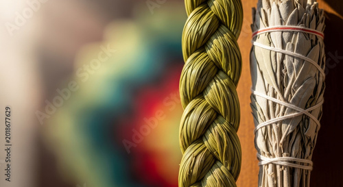 sweetgrass braid and sage bundle arranged for spiritual cleansing ritual and traditional wellness practice. Suitable for meditation and cultural ceremony themes