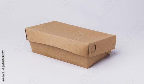 Closed eco-friendly brown paper lunch box isolated on white