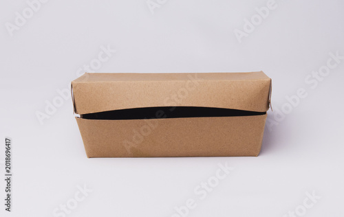 Closed eco-friendly brown paper lunch box isolated on white