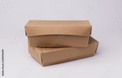 Closed eco-friendly brown paper lunch box isolated on white