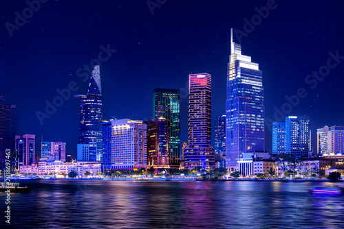 Fotografia Coastline with skyscrapers of Ho chi minh or Saigon city in Vietnam, night panor