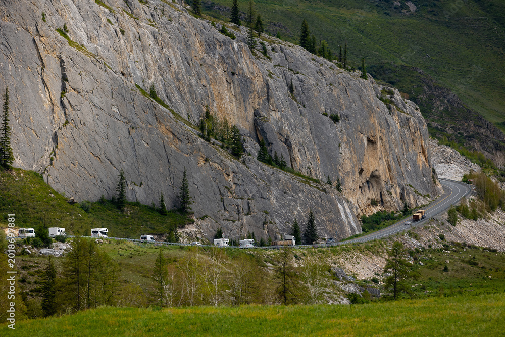 Naklejka premium Scenic road amidst Altai mountains, Russia with camper vans