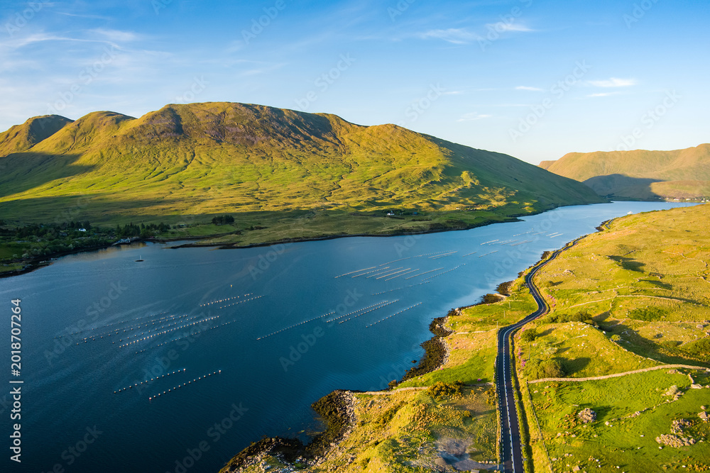 Fototapeta premium Aerial view of Killary Fjord near Leenane on the Galway Mayo border, Ireland. Irelands only fjord winds through the dramatic Connemara and Mayo mountain landscape.