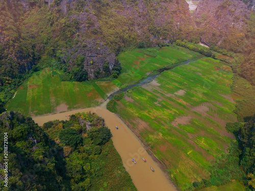 Tableau sur toile Scenic aerial view of lush rice fields and tranquil river in Ninh Binh, Vietnam