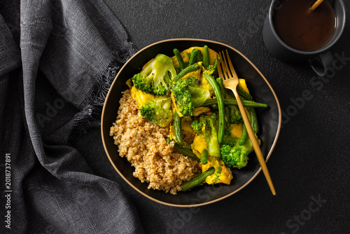Photos Healthy breakfast consists of a quinoa bowl with boiled eggs, green beans, and b