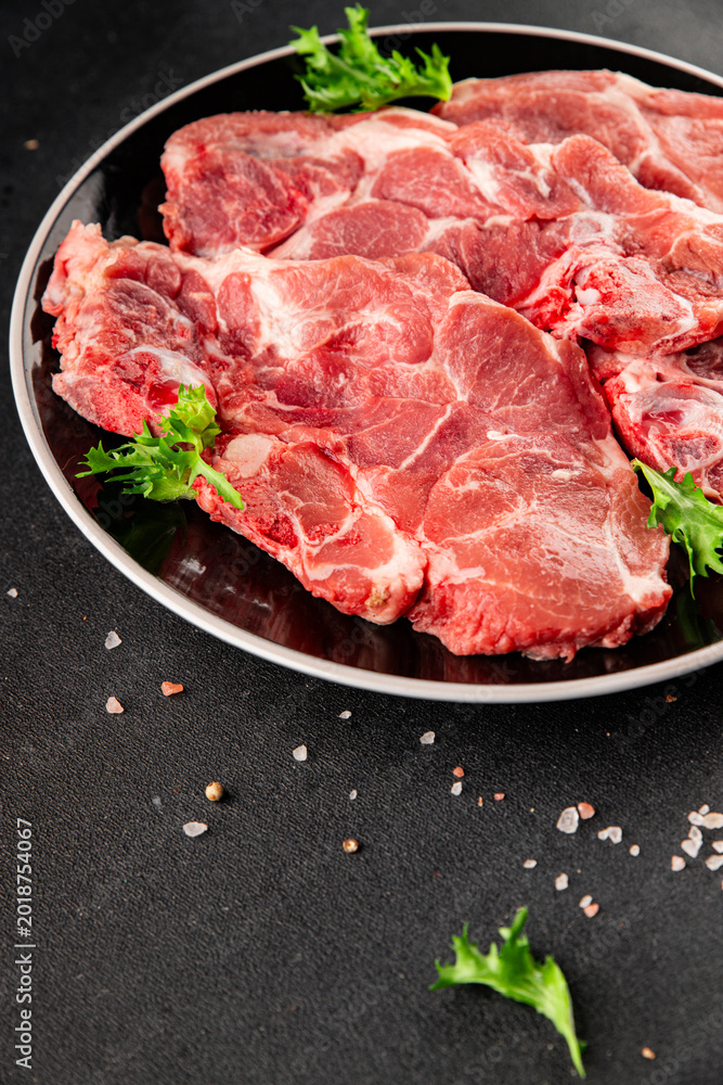 Fototapeta premium Raw pork steak pork tenderloin, food preparation lunch or dinner tasty organic snack fresh farm product delicious gourmet food background on the table rustic food, top view copy space