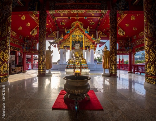 Ornate temple interior with Buddha