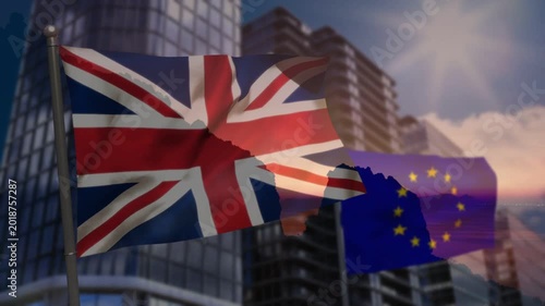 Strong breeze causing Union Jack unfurling while EU flag fluttering before glass high-rises
