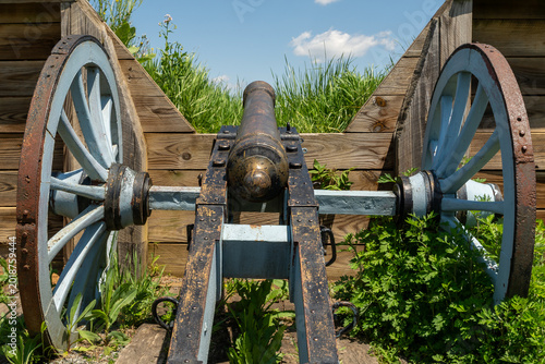 Revolutionary War cannon set within wooden defensive earthworks at Valley Forge on a clear spring day.