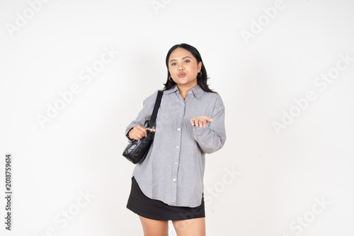 Foto Young woman gestures with hands, puckered lips