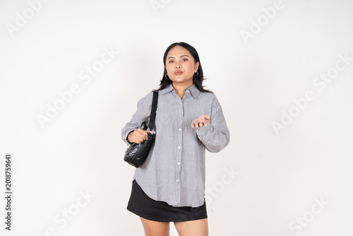 Foto Young woman gestures with hands, puckered lips