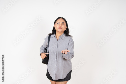 Konstfotografi Young woman gestures with hands, puckered lips