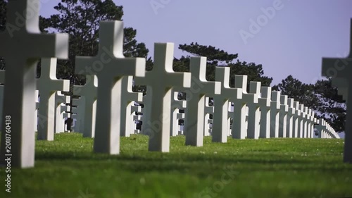 White crosses aligned at American war cemetery in Normandy. Historic memorial dedicated to soldiers of the D-Day landings