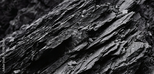 Close up of jagged layered rock formation in black and white