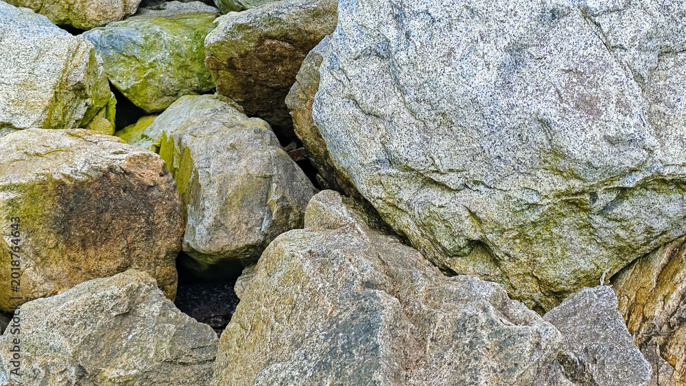 Naklejka premium Pile of large rough textured rocks
