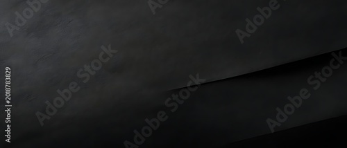 Vintage black paper surface with distressed grunge texture background.