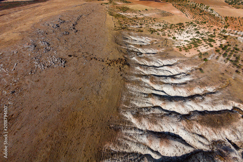 Canvastavla Severe erosion formations across semi-arid badlands terrain with calcareous soil