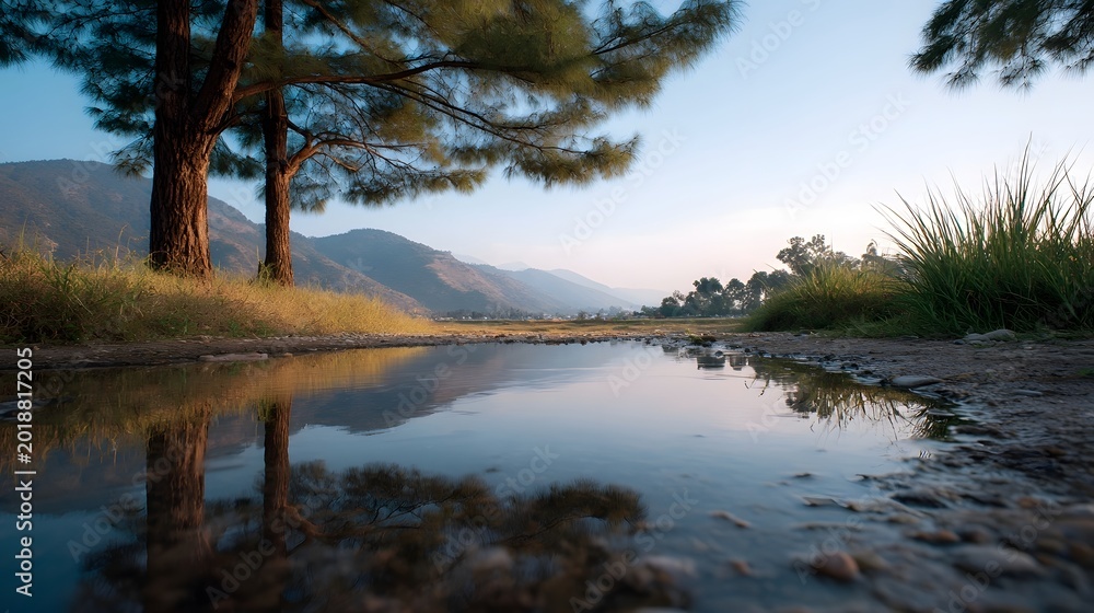 Obraz premium Serene twilight scene capturing reflections of mountains and trees in still waters