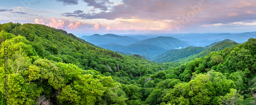 Bright sunset in Smokey Mountains summer woods. Appalachian mountains in North Carolina with fresh green forest trees in summertime season. Beauty of USA nature