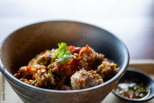 Stir Fried Crispy Pork Belly with Salt and Chili, served in a bowl